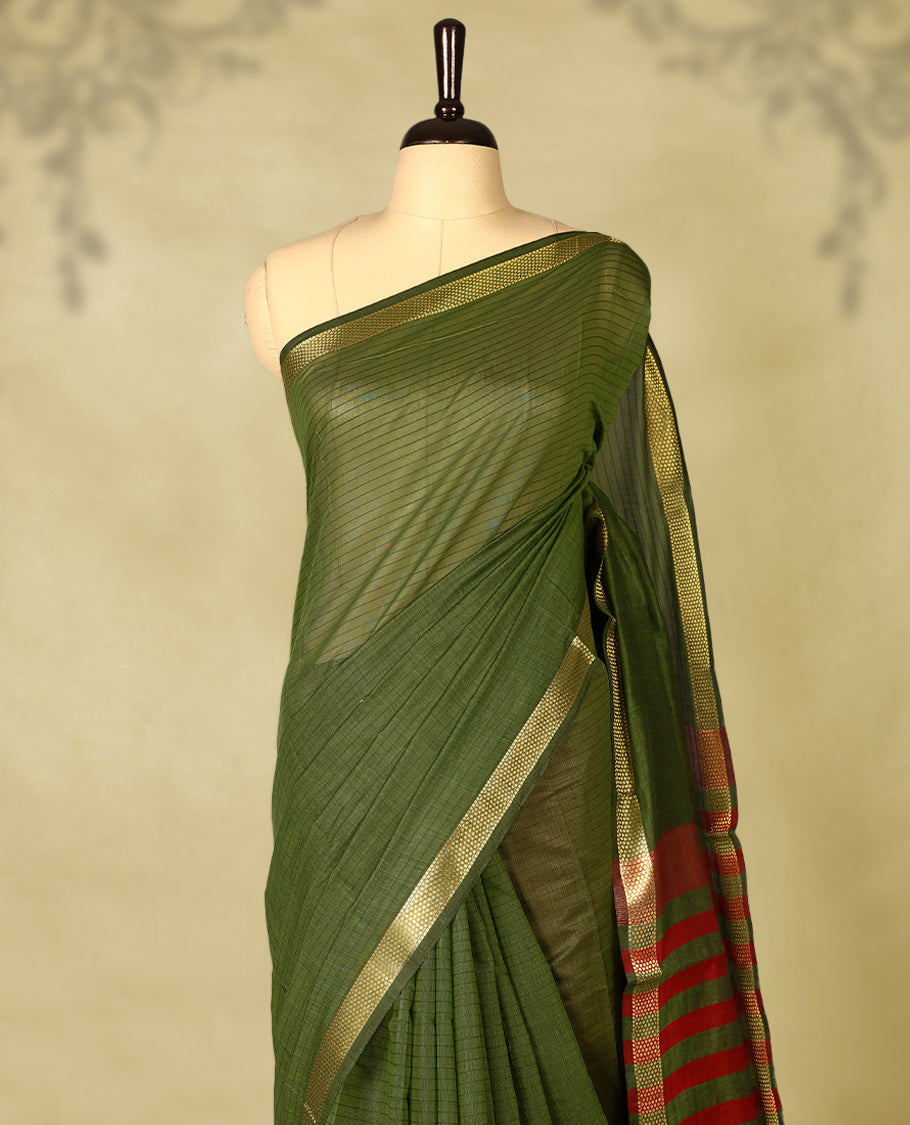 Grass Green colour chanderi cotton saree with fine striped body, mangalgiri border, grand pallu featuring Red and gold zari stripes, with matching blouse.
