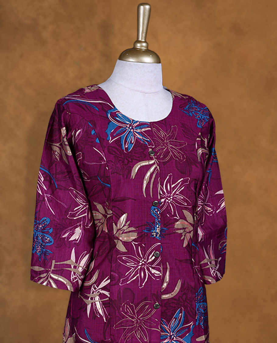 Wine colour kurti splashed with bold floral prints in beige and blue, styled with a scoop neckline, front button detailing and comfy 3/4th sleeves.