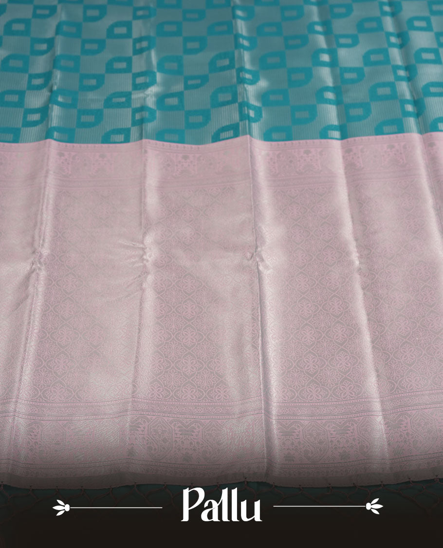 Teal Green colour Semi Silk Saree with Self-Checked Geometric Patterns on the Body, Contrasting Ice Silver Zari Woven Pallu and Border Featuring Intricate Paisley-Floral Motifs and Tassels, Paired with Coordinated Blouse Piece