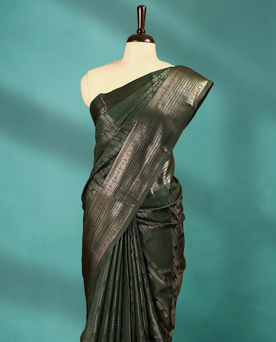 Dark Bottle Green Art Soft Silk Saree showcases intricate silver zari work on the body and border, paired with a matching blouse