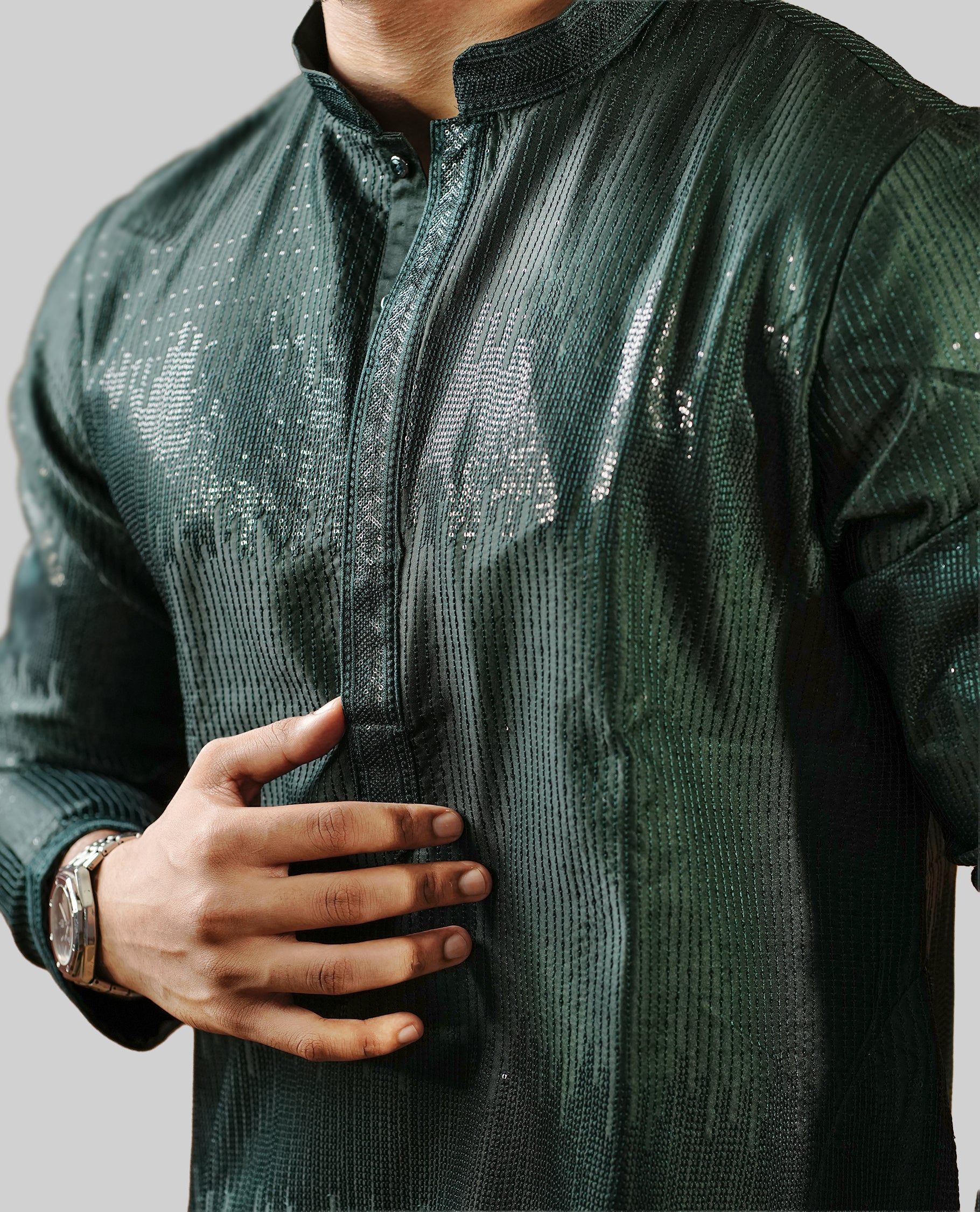 Dark Green colour men's kurta featuring elegant thread and sequins work on the body, complemented by full sleeves for a refined and festive look.
