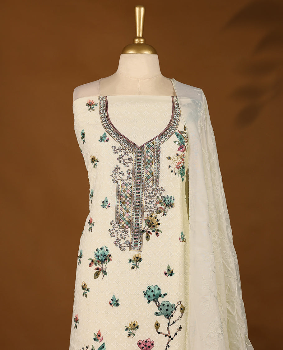 Off-white embroidered top with multi-colour prints & green border, includes matching bottom and threadwork dupatta.
