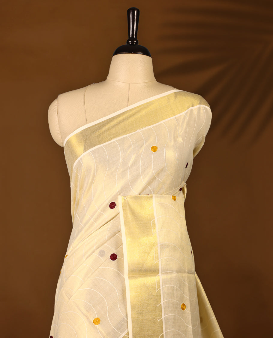 Light Gold colour Tissue Kerala saree featuring Thread work on the body and a beautifully woven Gold Kasavu border, paired with a matching blouse perfect for festive occasions.