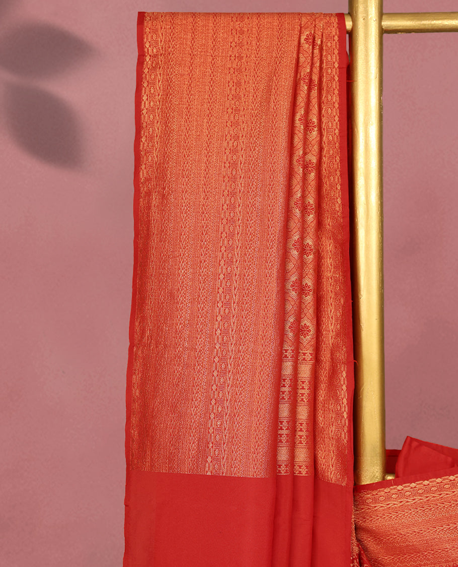 Red colour Kancheepuram saree featuring an antique zari brocade body, complemented by a traditional border and a matching blouse.