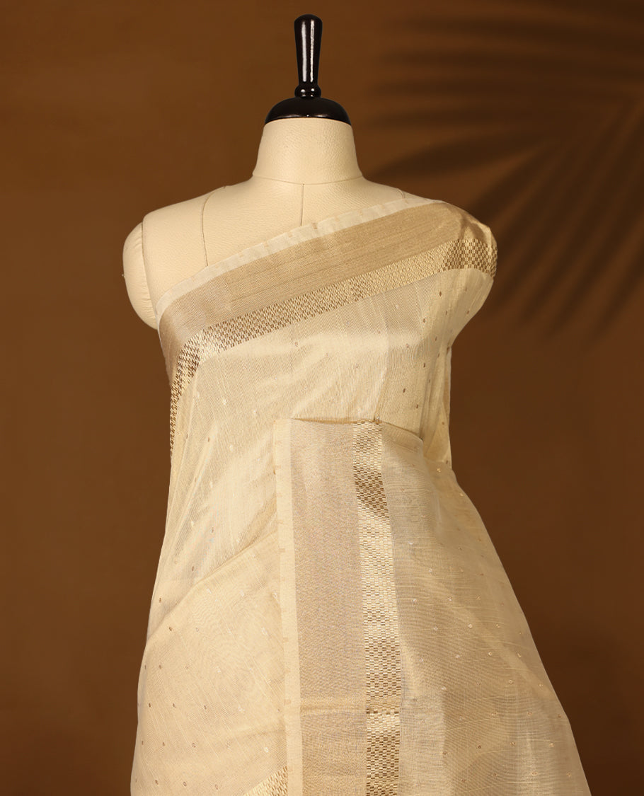 Light gold colour Organza Kerala saree featuring a sheer, smooth body, Gold Kasavu border, Peacock printed pallu, Comes paired with a coordinated matching blouse.