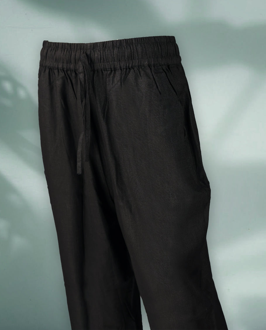 Black Colour women's casual pants feature a relaxed, ankle length silhouette with an elastic waistband and drawstring closure