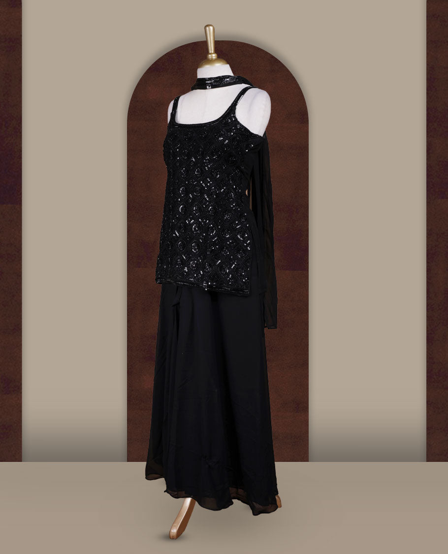 Vibrant Black colour sharara set featuring a sleeveless sequin embellished top with delicate beadwork, paired with a flowy flared bottom and dupatta for a contemporary festive look.