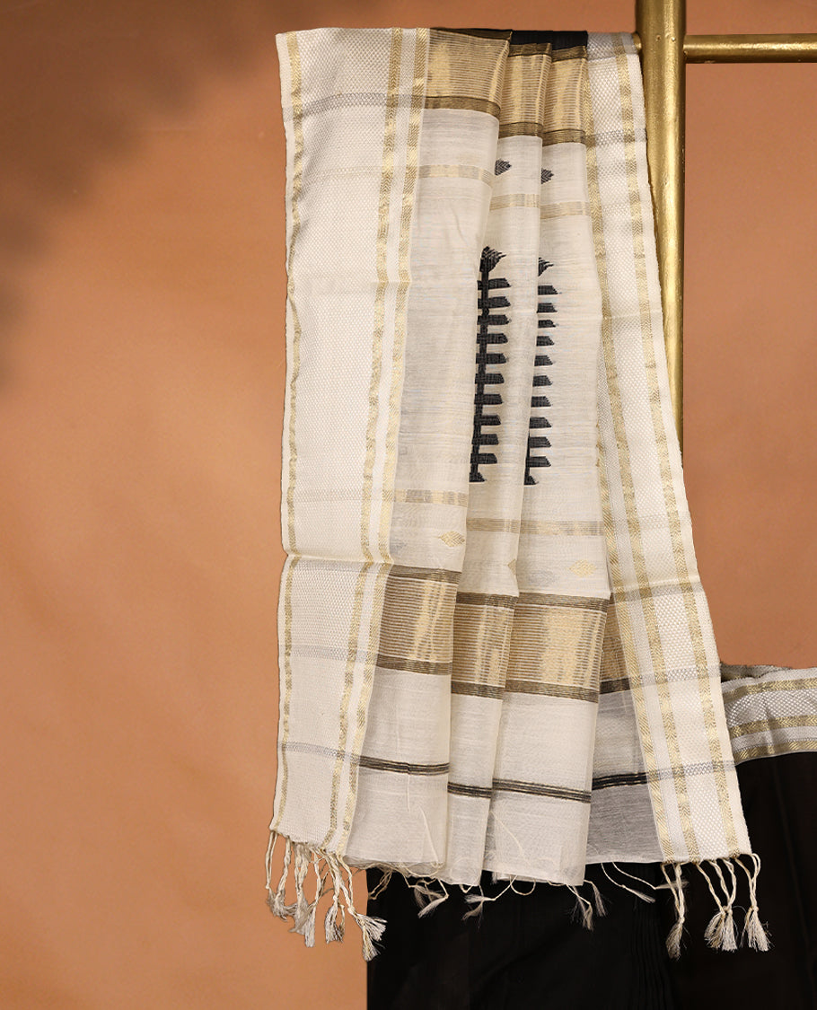 Pure Black coloured Maheshwari Cotton saree featuring Antique Zari Leaf motifs across the entire body, complemented by a traditional White coloured border and a matching blouse.