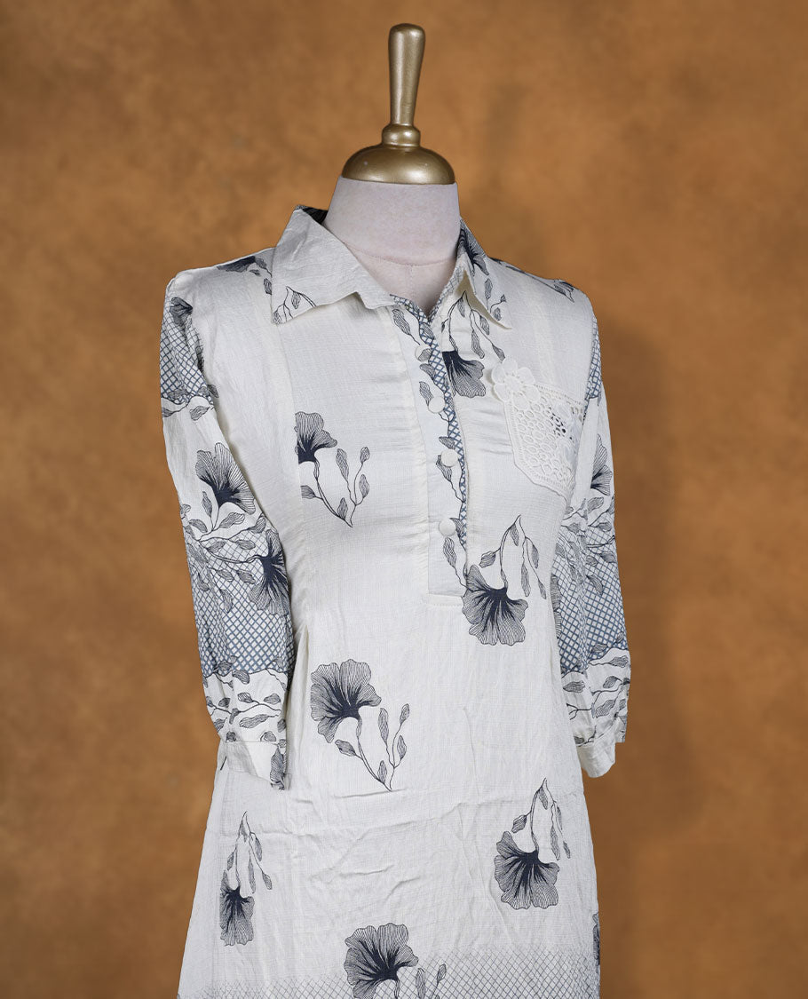 Ivory and grey floral printed shirt dress with collared neckline, half button placket, lace-appliqué detail on chest, three-quarter sleeves, and scalloped hemline