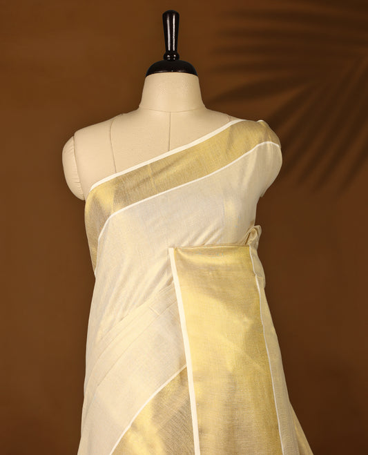 Light Gold colour Tissue Kerala saree featuring Plain body and a beautifully woven muted Gold Kasavu border, Grand Pallu paired with a matching blouse perfect for festive occasions.