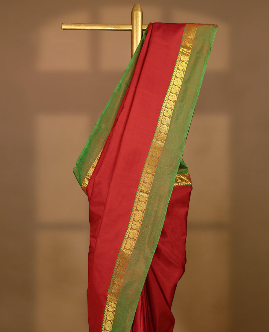 Red Colour Pure Kancheepuram Traditional Silk Saree having Plain Body with Light Green Border and Blouse