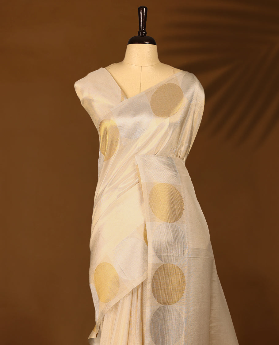 Ivory, gold and Silver soft tissue Kerala saree featuring a Plain Body, striking Circle border with a matching blouse