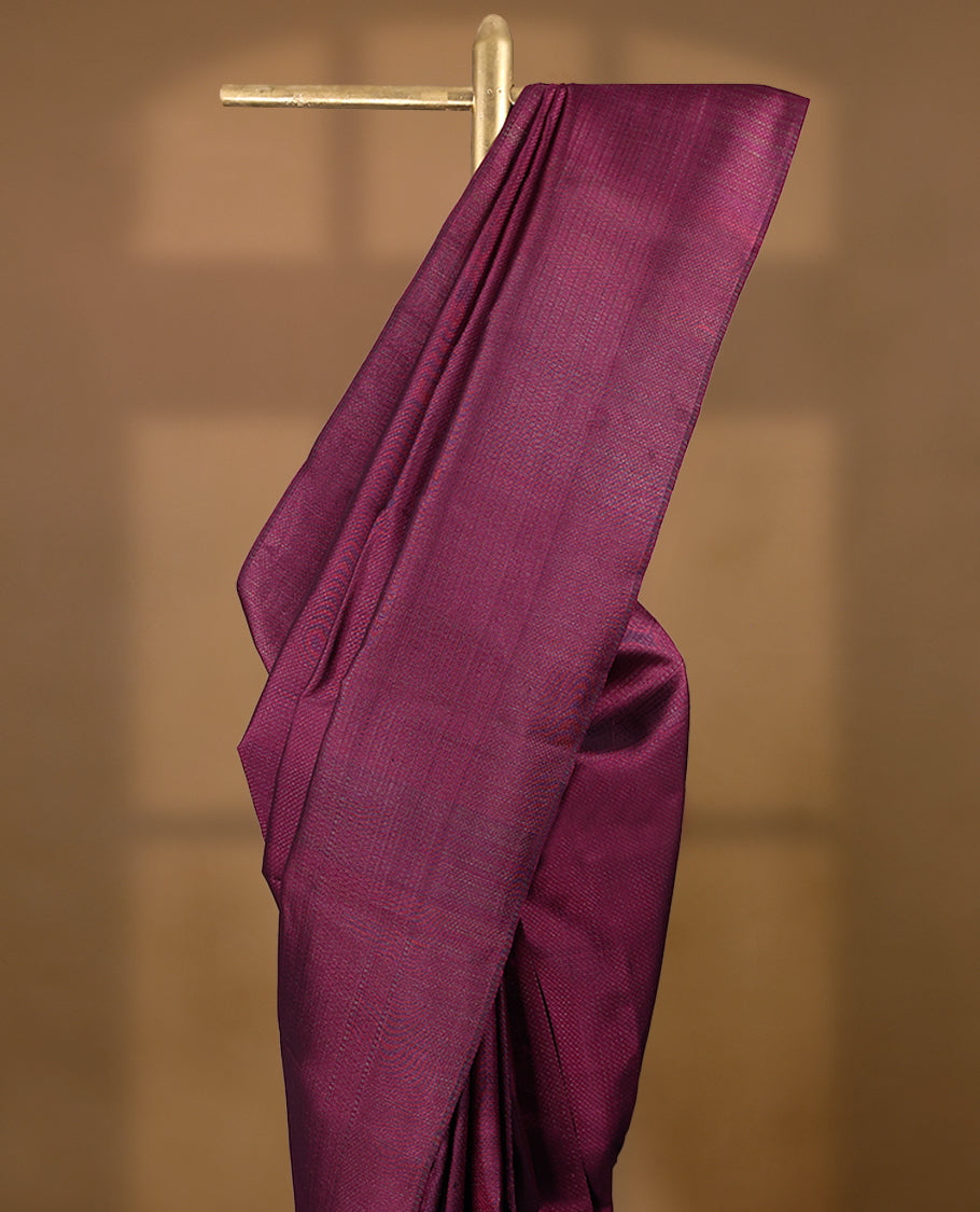 Cranberry coloured Manthrakodi saree featuring a multicoloured zari jacquard body, complemented by a self coloured turning Banarasi border and a matching self coloured blouse.