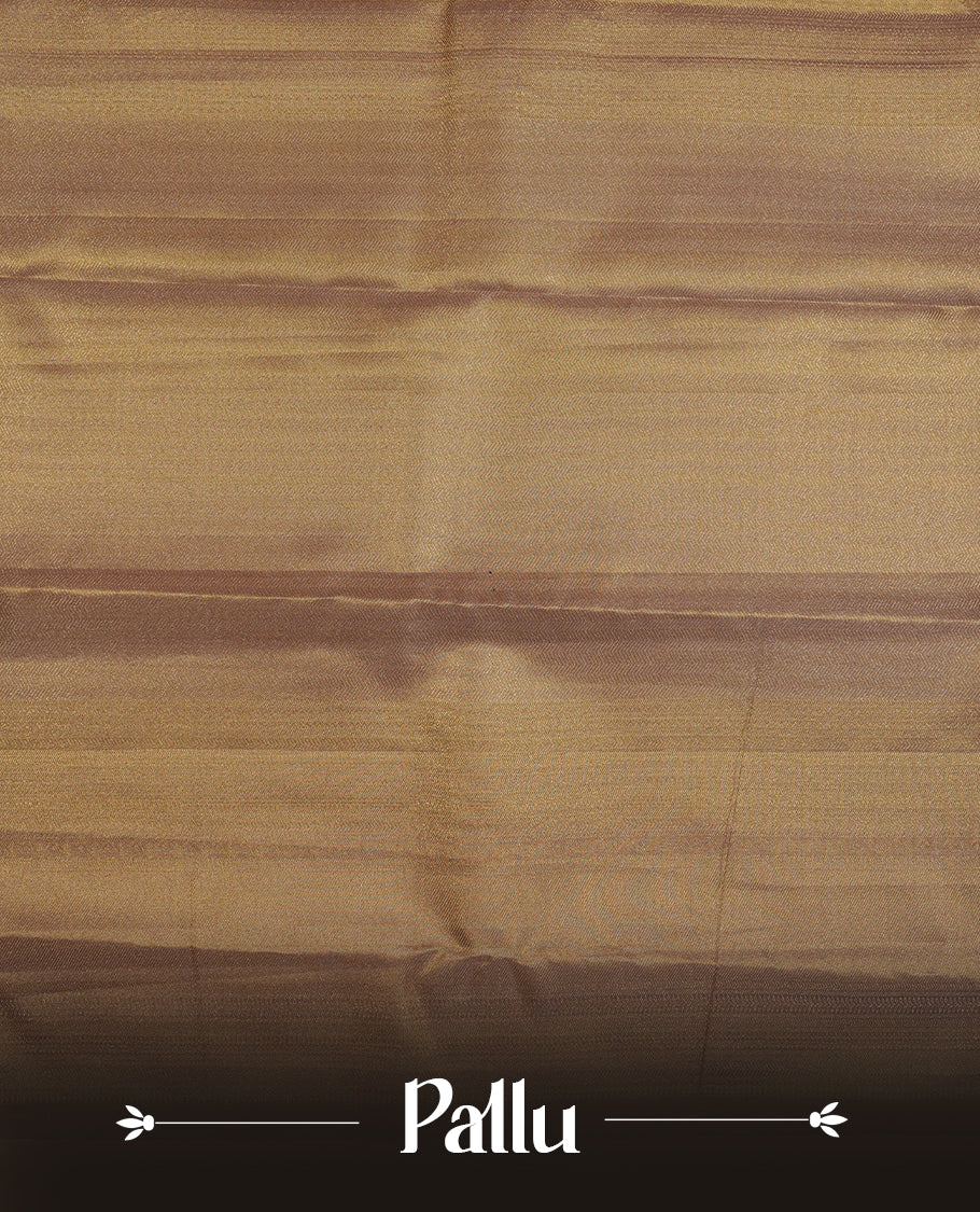 Gold colour kancheepuram tissue silk saree highlighting gold zari pattern body, with contrast Light pinkish beige colour colour with traditional border and paired with matching blouse.