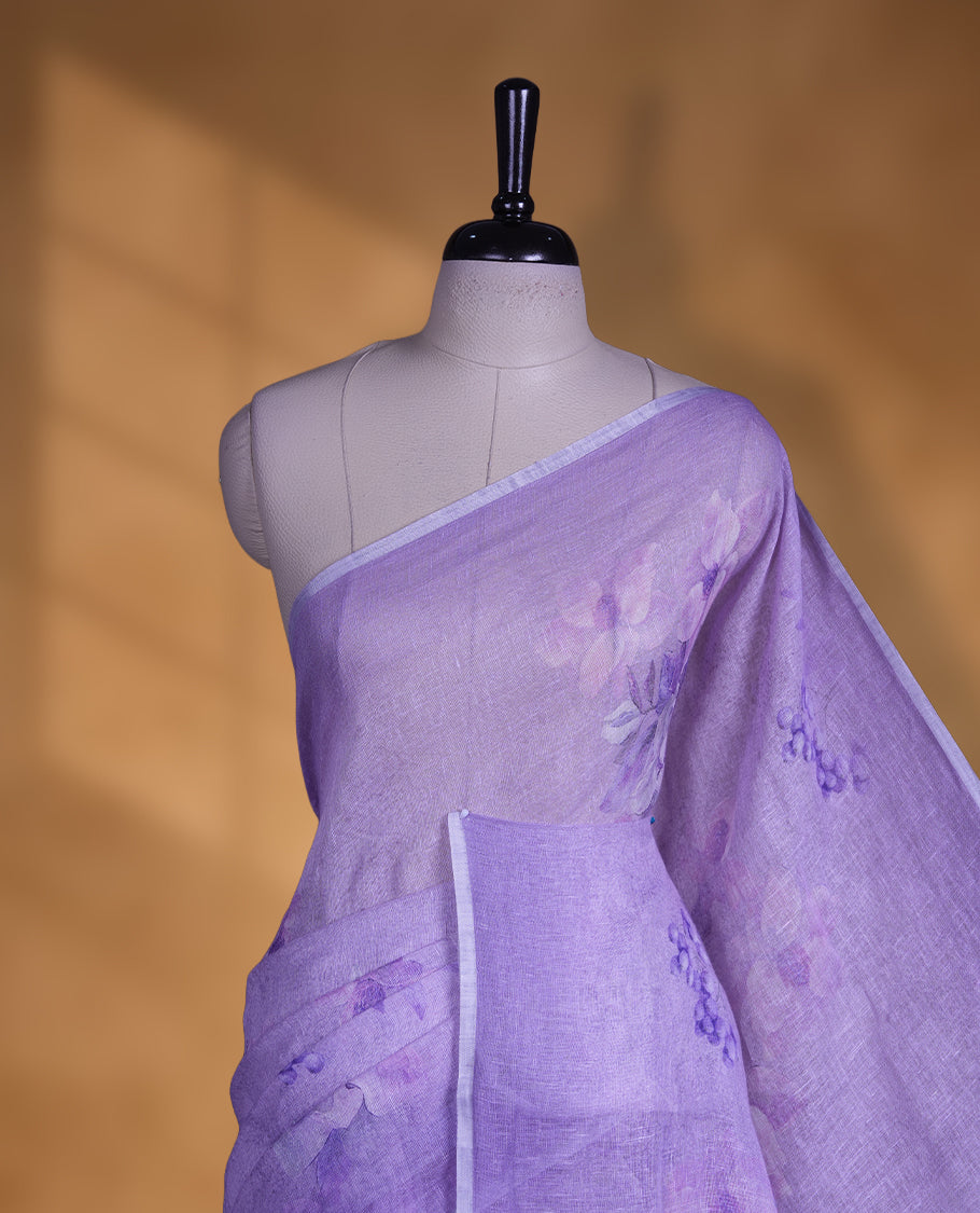 Light purple colour pure linen saree featuring Floral print pattern across body, silver thin border finished with matching blouse.
