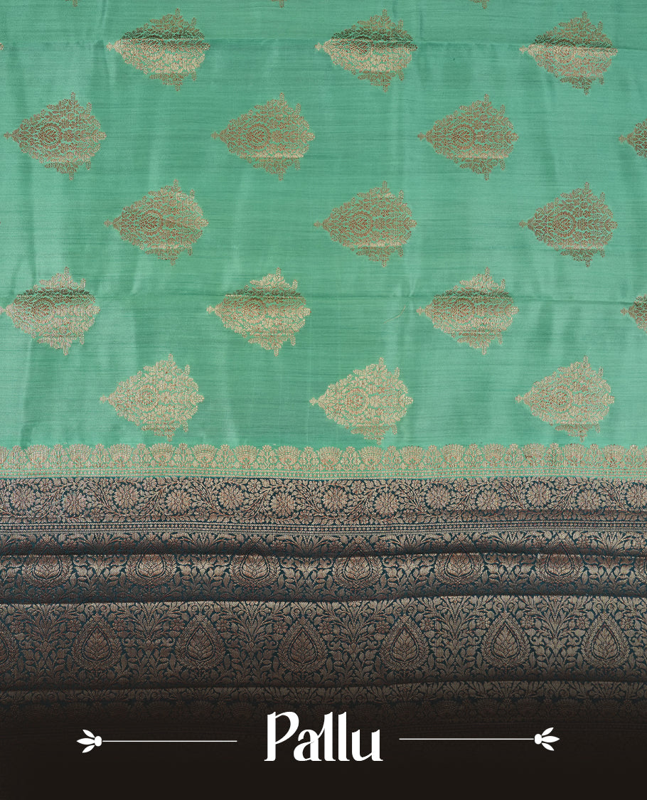 Mint Green Colour Banaras Soft Silk Saree with Gold Zari Diamond Leaf Buttas, Intricate Multi-Layered Floral Border, Grand Pallu with Ornate Sunflower Motifs in Dark Green and Gold Tones, and Matching Teal Blouse.