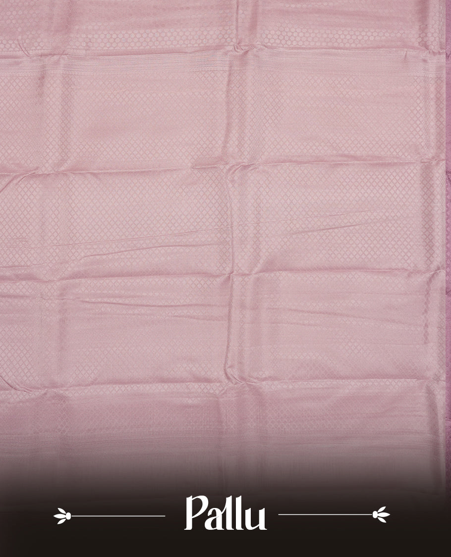 pastel purple colour semi-soft silk saree featuring a self coloured textured patterned body, complemented by self coloured motifs on pallu & border and a matching blouse piece.