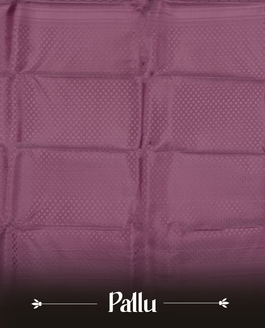 Dark mauve colour semi soft silk saree featuring a self coloured textured patterned body, complemented by self coloured motifes on pallu & border and a matching blouse piece.