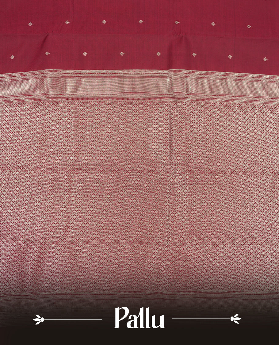 Maroon colour semi soft silk saree featuring a gold floral patterned body, complemented by gold traditional pallu & border and a matching blouse piece.