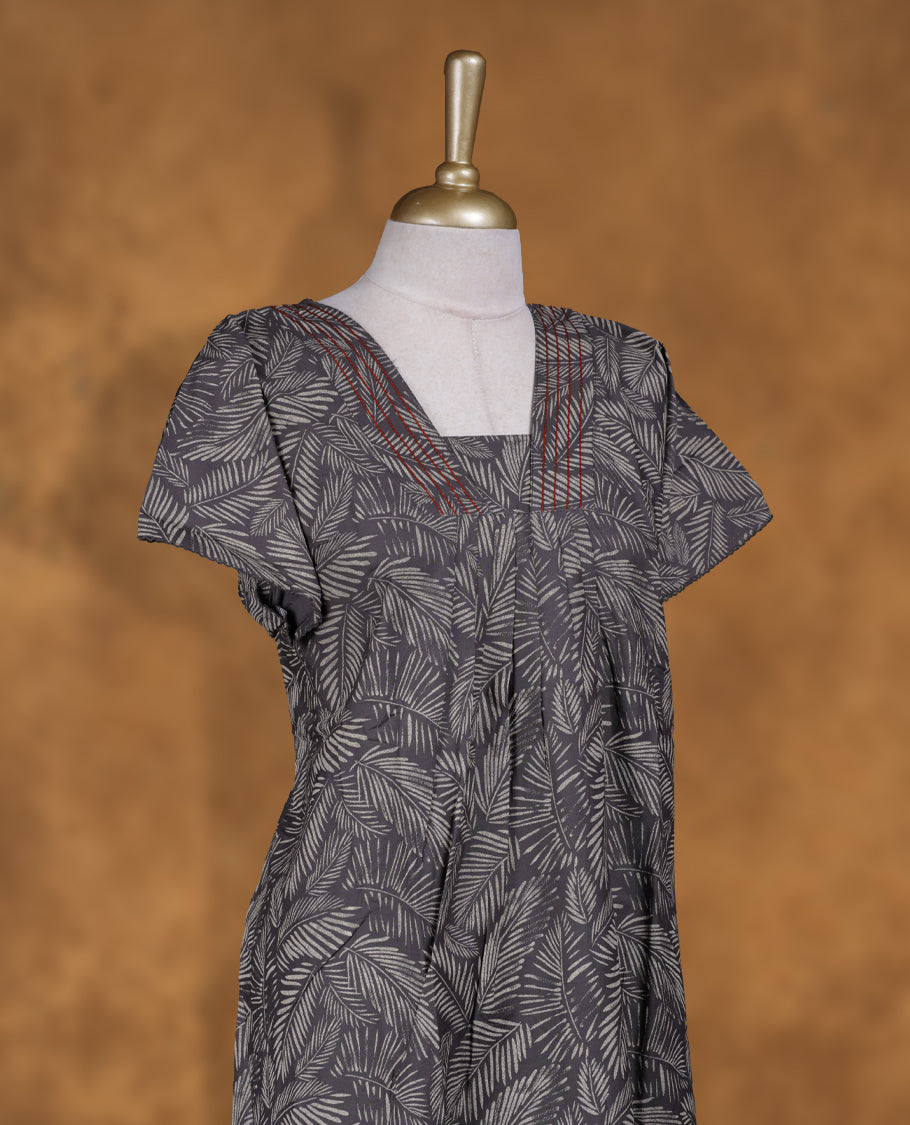 Dark Grey colour Nstyle nighty with leafy print featuring a stylish design, V-neckline with lace detailing, short sleeves, and a full-length