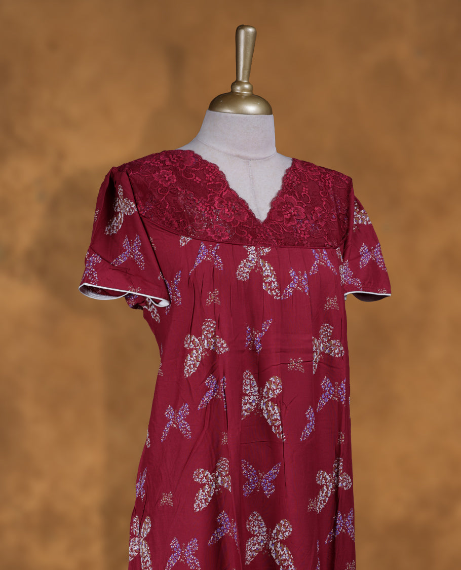 Dark red colour NStyle nighty featuring butterfly patterns, a V neckline with design lace, short sleeves, and a full ankle-length design.
