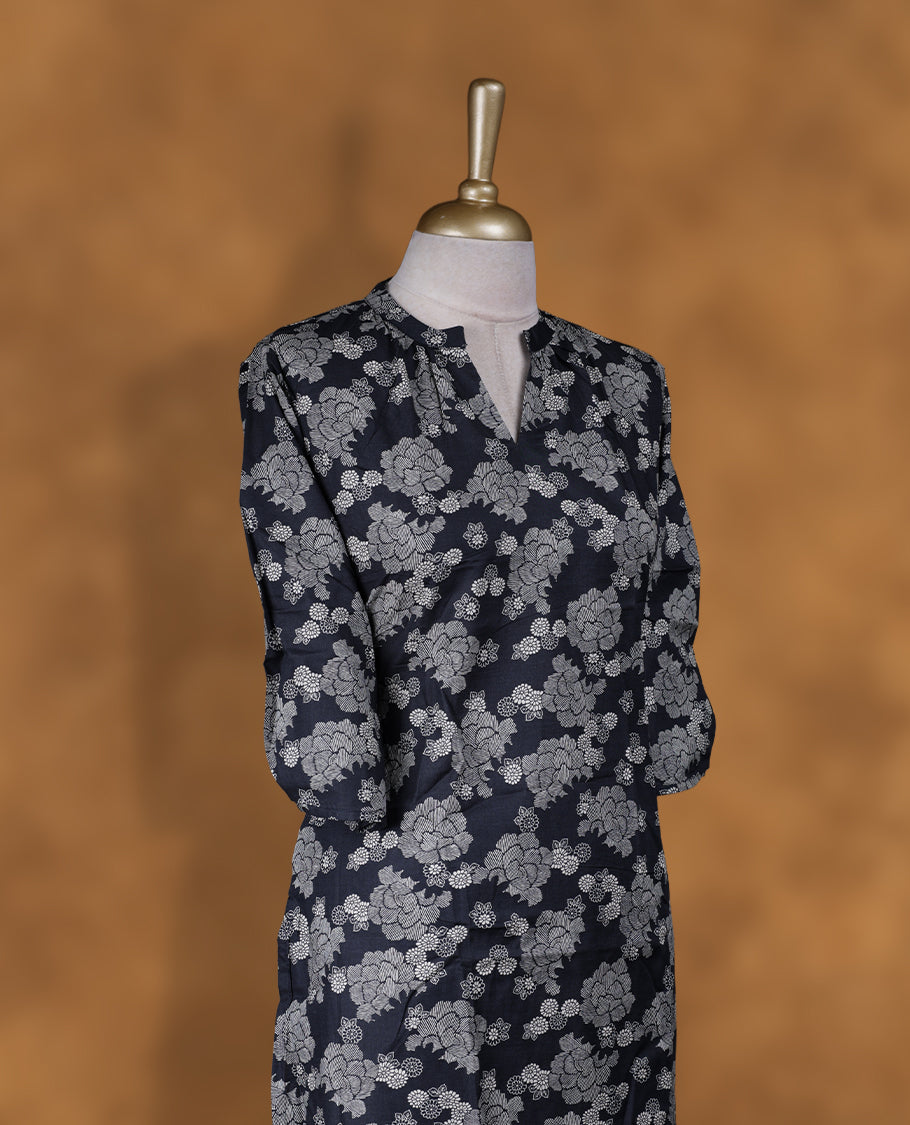 Black colour kurti with styled with a round with split neckline & Floral print across body, knee length design, and a sleeve .