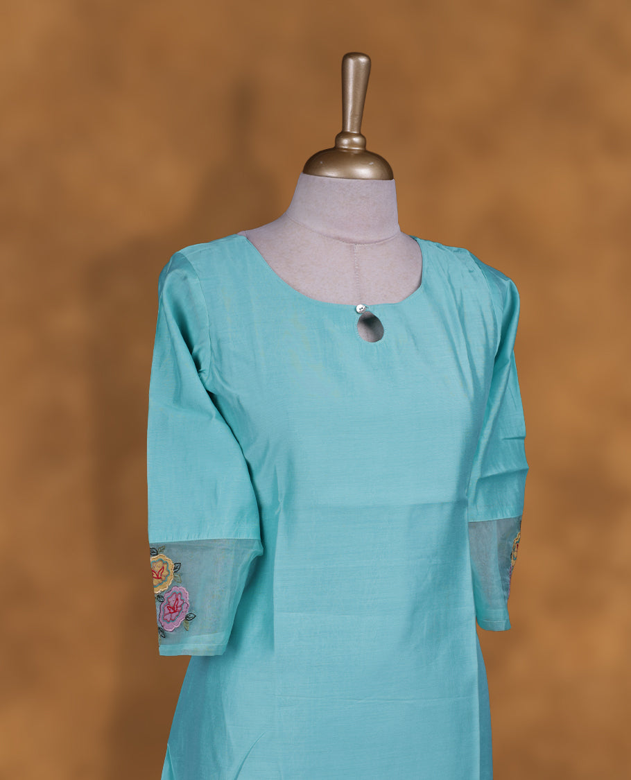 Aqua blue colour kurti with styled with a round with ovel with button neckline, print on body knee length design, and a sleeve .