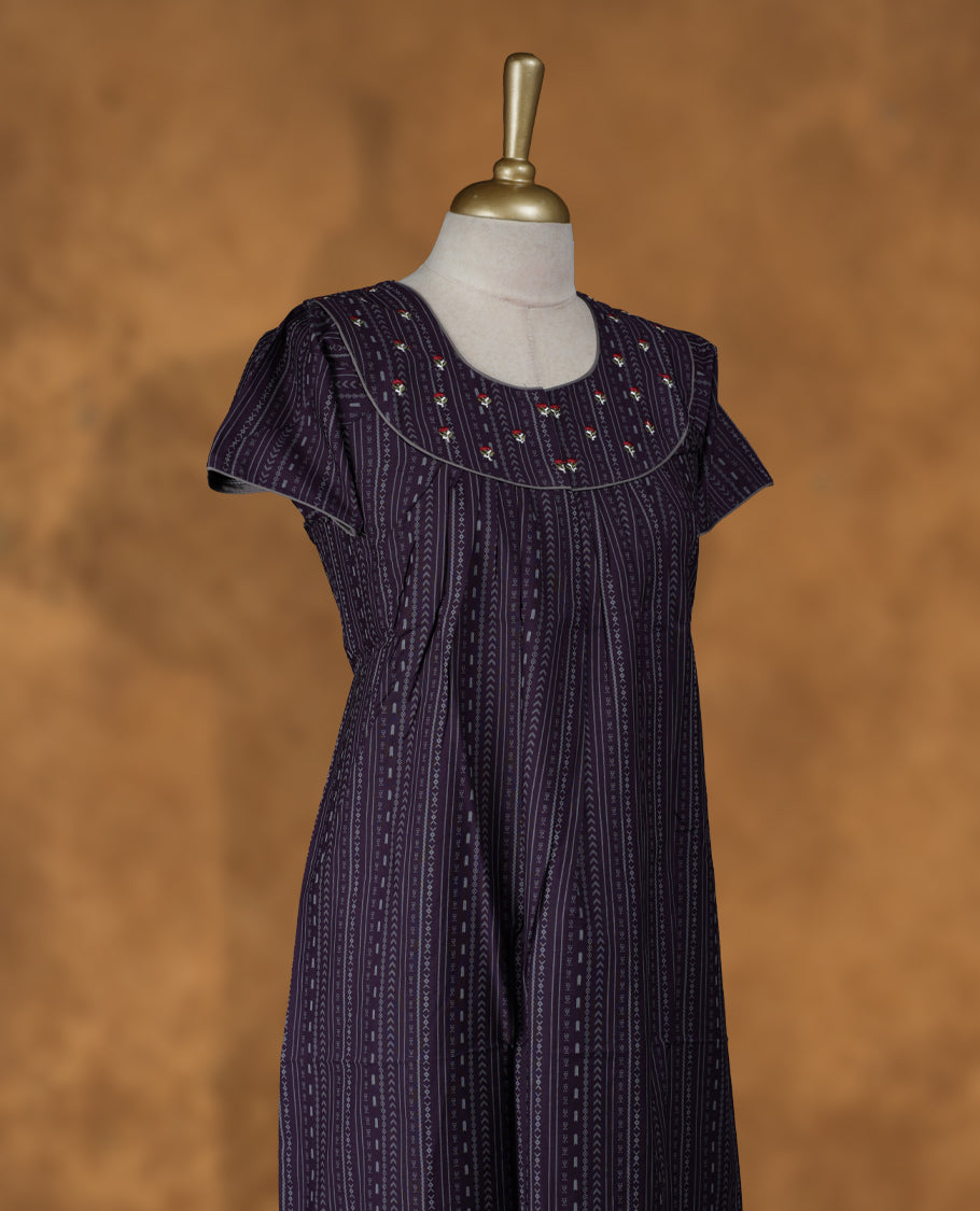 Purple colour NStyle nighty featuring striped patterns, a round neckline with floral embroidery detailing, short sleeves, and a full ankle-length design