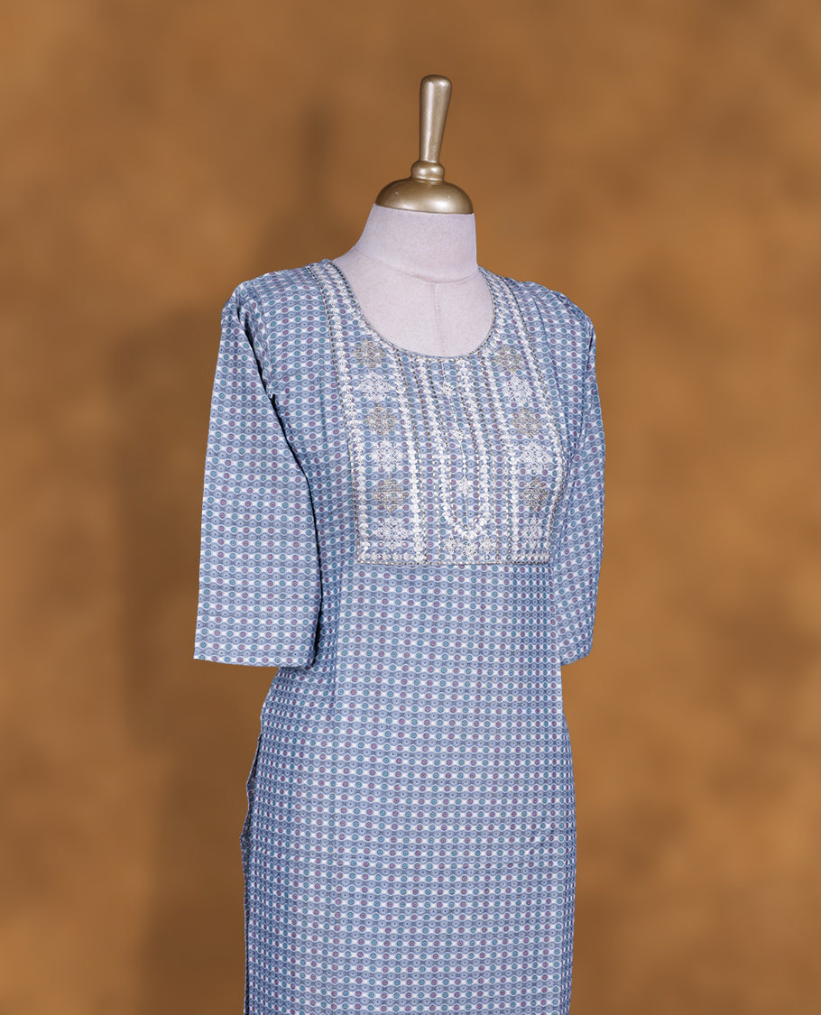 Gray colour kurti with styled with a thread pattern around neckline, print pattern on body, knee length design, and a sleeve .