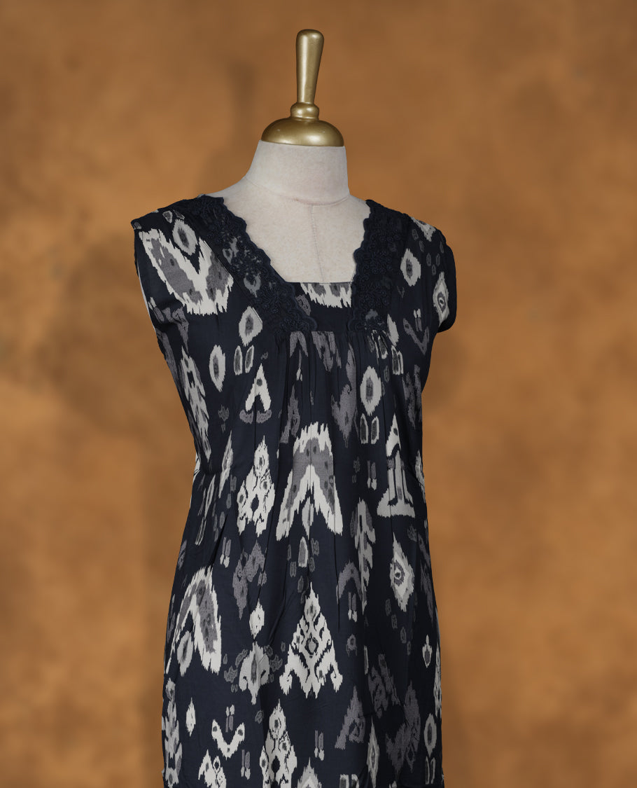 black colour Nstyle nighty with featuring a White & lavender pattern, a V neckline with lace detailing, sleeveless, and a full-length