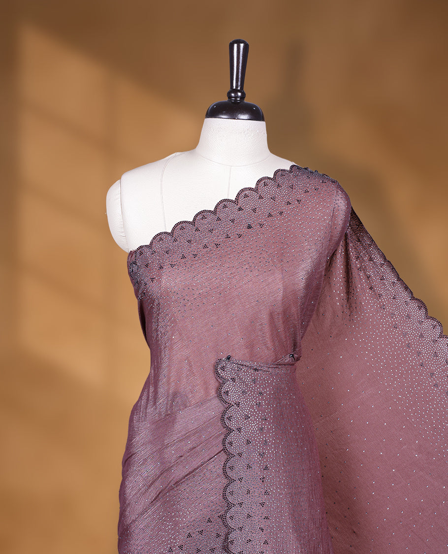 Brown colour chiffon designer saree, featuring black and white scattered stone on body, stone work and heavy stone leaf pattern on border and pallu, Paired with matching blouse.