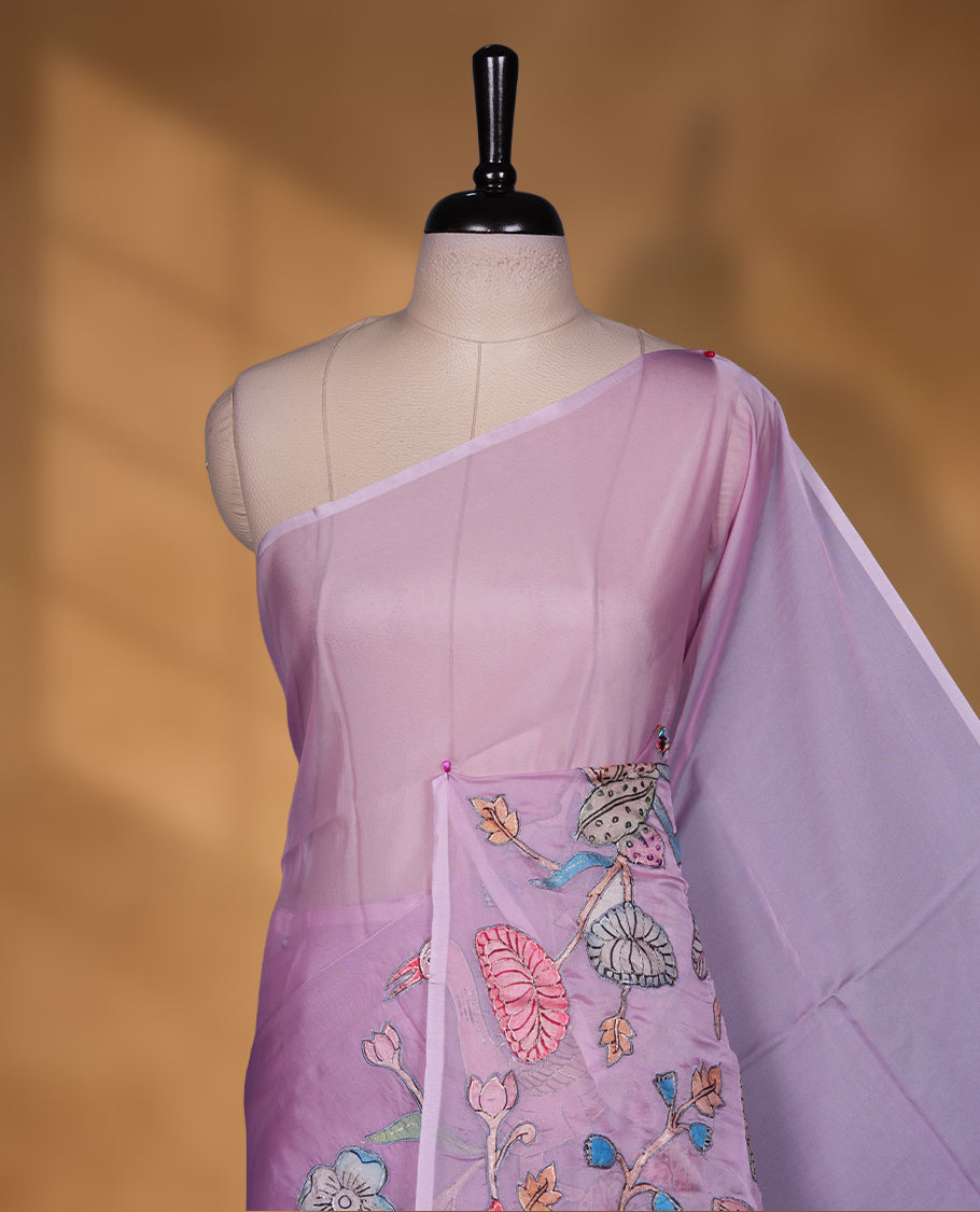 Lavender colour organza saree with multicolour thread embroidery on the pallu and fine border detailing, paired with a matching blouse. (Copy)