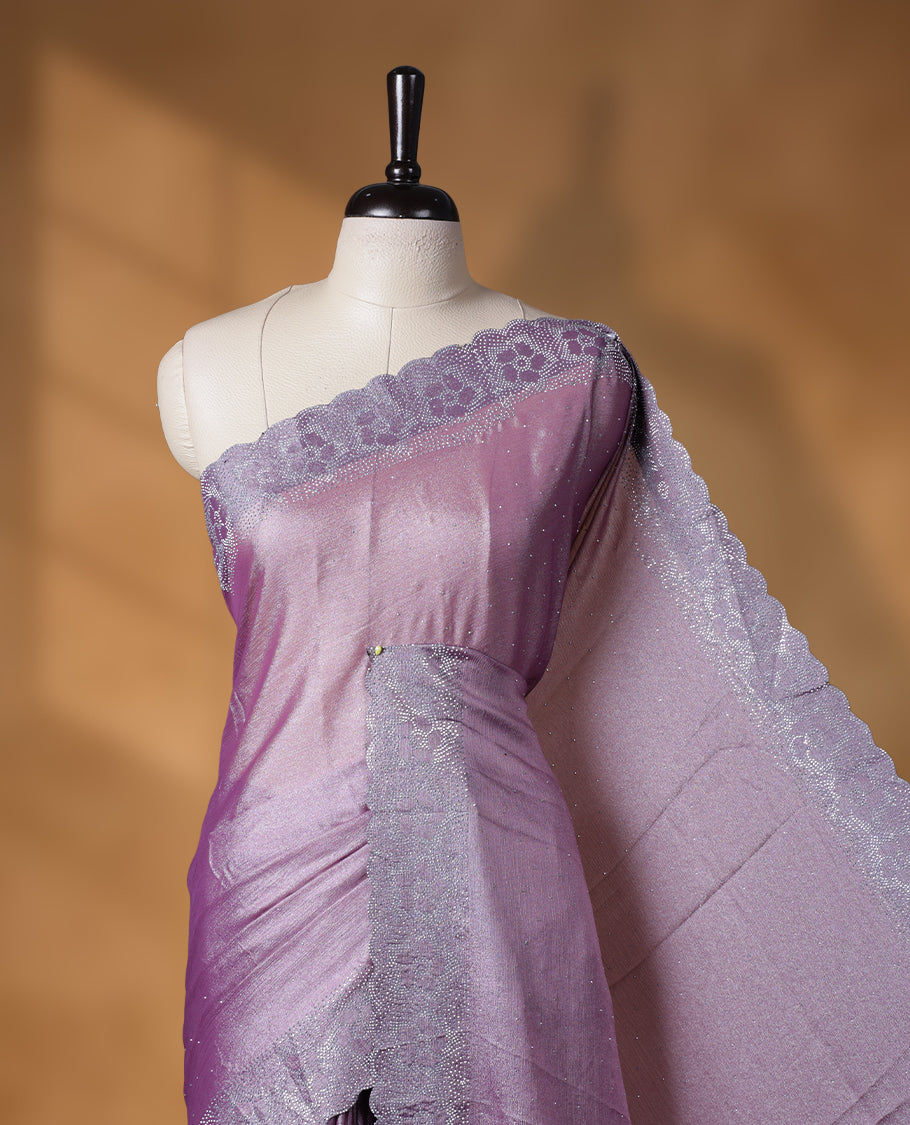 Lavender colour shimmer designer saree, featuring white scattered stone on body, stone work and heavy stone floral pattern on border and pallu, Paired with matching blouse.