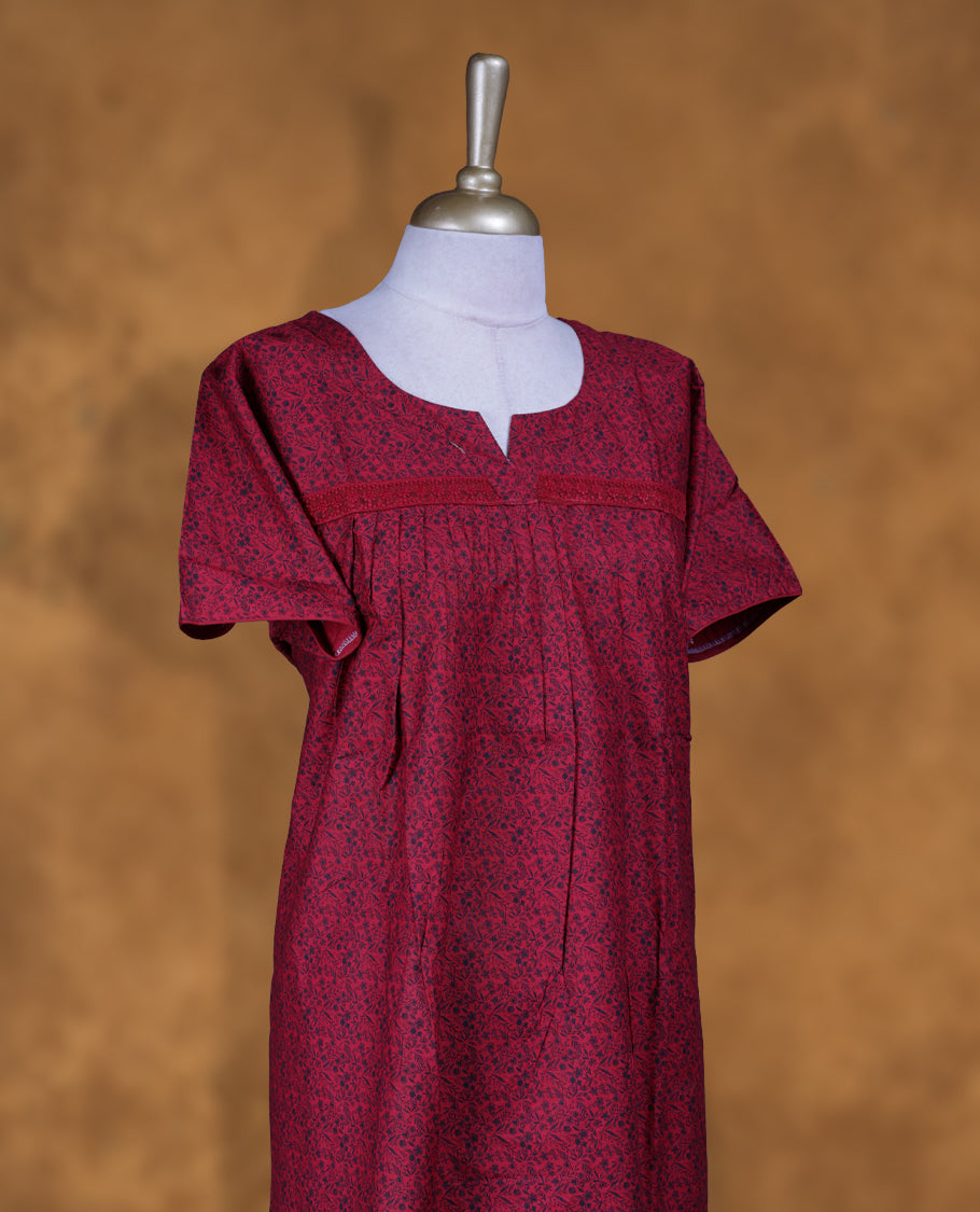 Red colour NStyle nighty features an all-over Black little floral pattern, a round neckline with a slight V-cut, short sleeves, and a full ankle-length design.