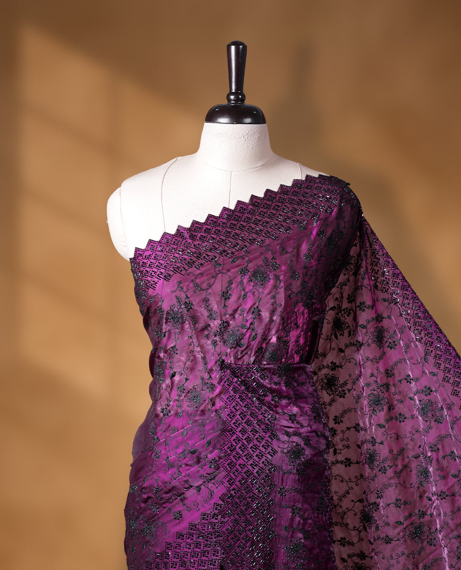 Dark Purple colour velvet chiffon designer saree, featuring black thread embroidery kodi pattern on body, black cut stone work and heavy stone border, pallu and Paired with matching blouse.
