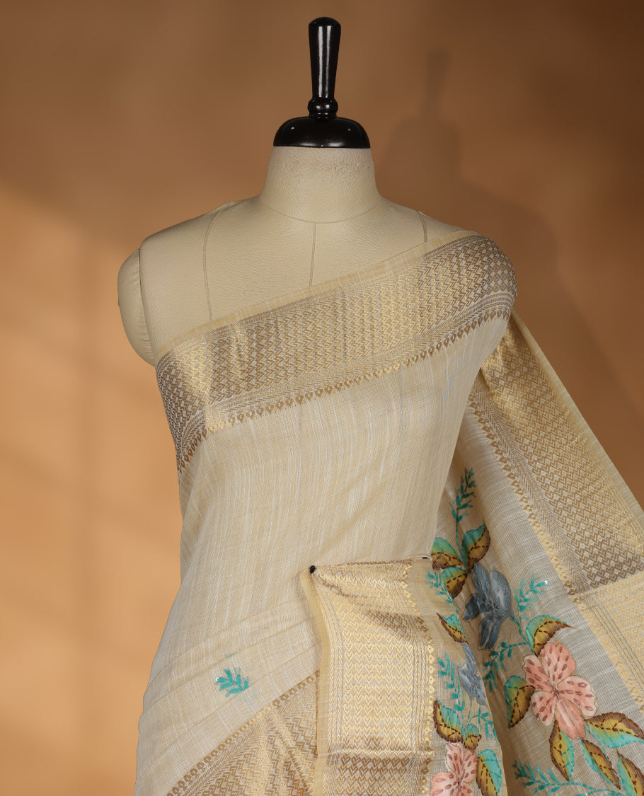 Beige colour Banarasi linen silk saree featuring hand brushed colour with Floral & birds printed pattern on body, gold zari woven geometric design border with self colour pallu and comes with a matching blouse