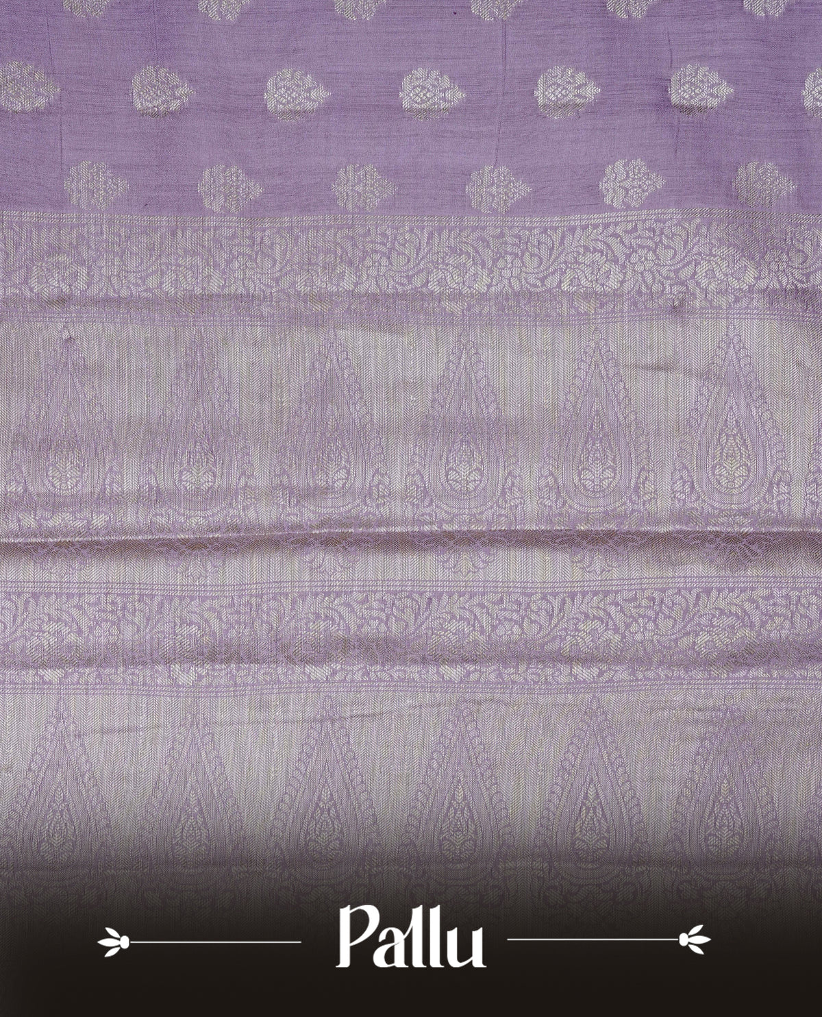 Lavender colour Banaras saree featuring Silver zari buttas on body, complemented by zari pattern on self colour border, comes with matching blouse piece.