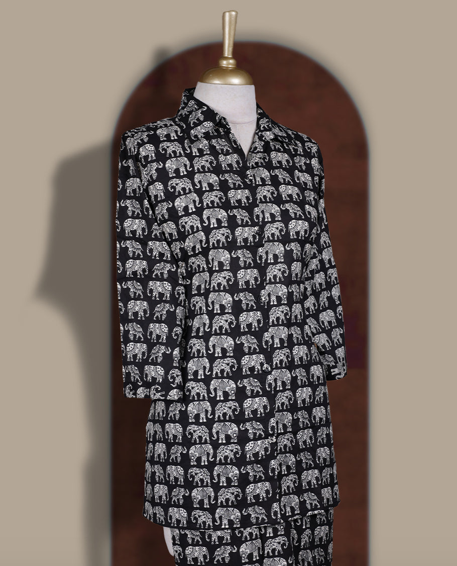 Black colour cotton coord set featuring charming elephant prints all over, Designed with a classic shirt collar and 3/4 sleeves, paired with matching straight pants for a trendy, relaxed, and comfy everyday look.