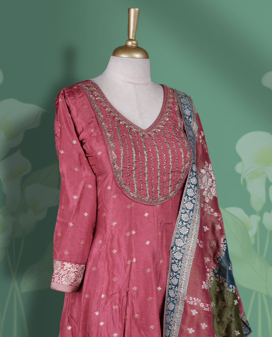 Dark Mauve colour Anarkali Suit with V neck embellished with cut beads, pearls, and sequins, Paired with a vibrant Banarasi dupatta featuring floral motifs and zari border & Comes with a plain matching bottom.