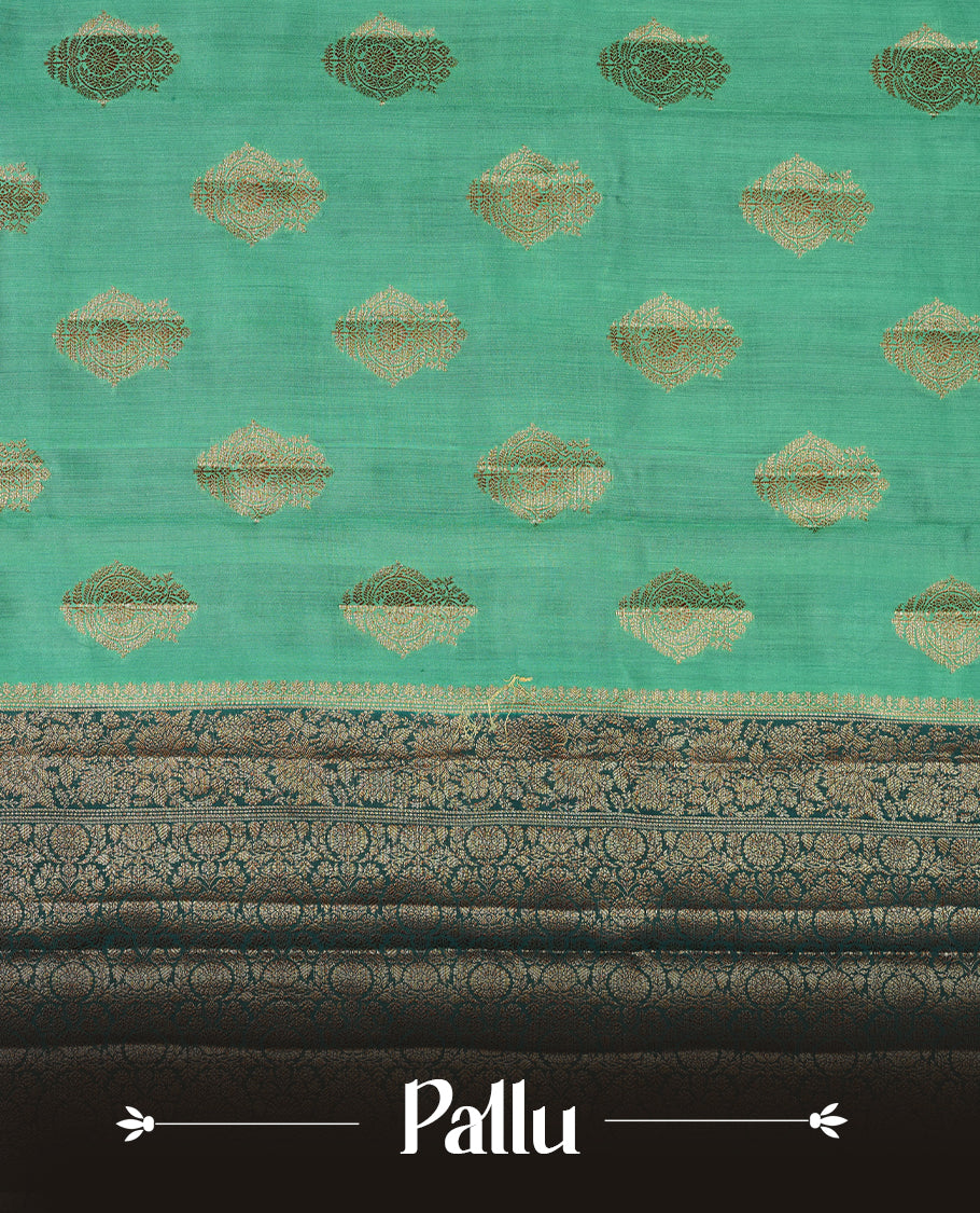 Teal Banaras soft silk saree with gold zari motifs on body, with contrast Dark teal colour floral pattern on pallu, border, and Matching blouse.