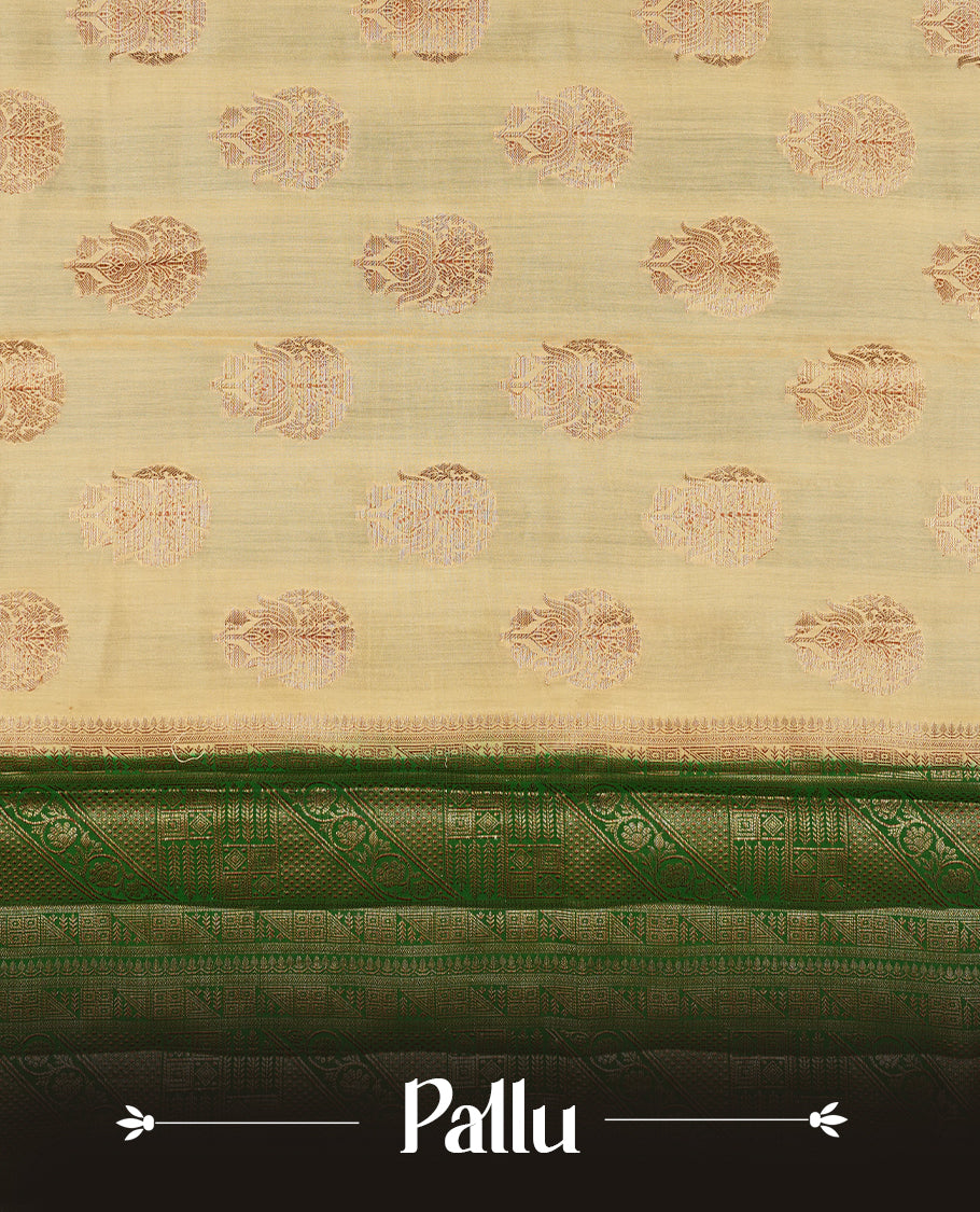 Cream beige Banaras soft silk saree with gold zari oval motifs on body, with contrast green colour floral pattern on pallu, border, and Matching blouse.