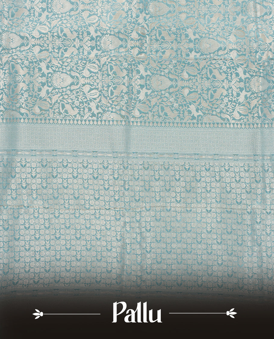 Light Blue colour Mysore Crepe Silk saree fearturing gold Zari kodi visiri & Animal brocade pattern on body and self colour border paired with matching blouse