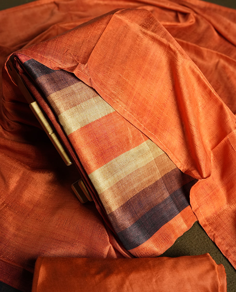 Orange colour churidhar material featuring elegant horizontal stripes on the yoke and dupatta, woven in shades of Brown and Orange & Paired with a matching plain bottom