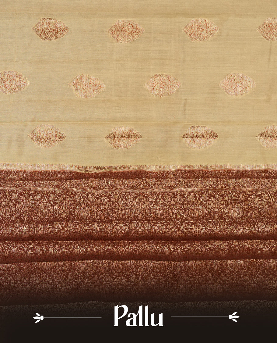 Cream beige Banaras soft silk saree with gold zari oval motifs on body, with contrast Chocolate brown colour floral pattern on pallu, border, and Matching blouse.