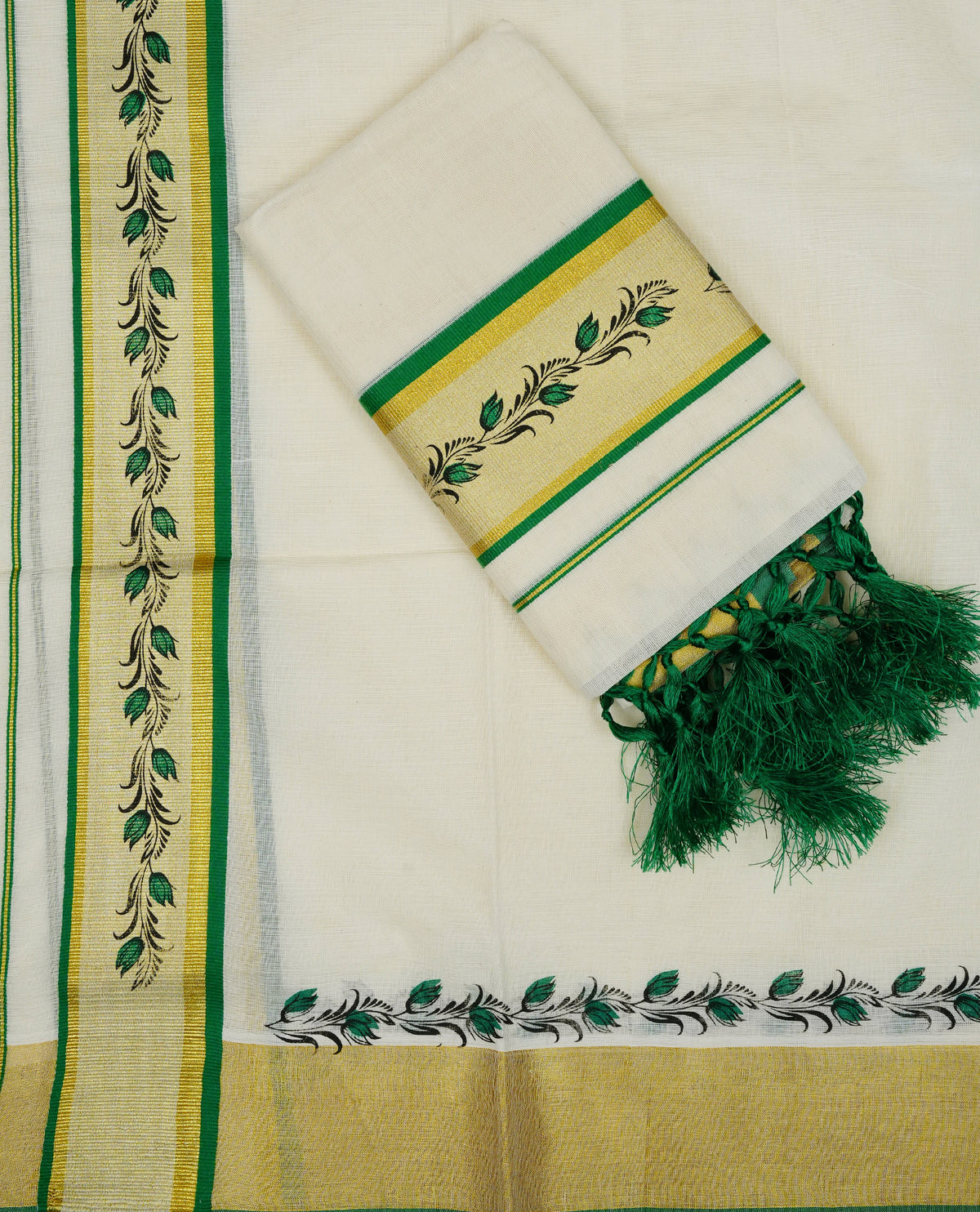 Cream colour cotton set mundu featuring Green & gold kara with print.