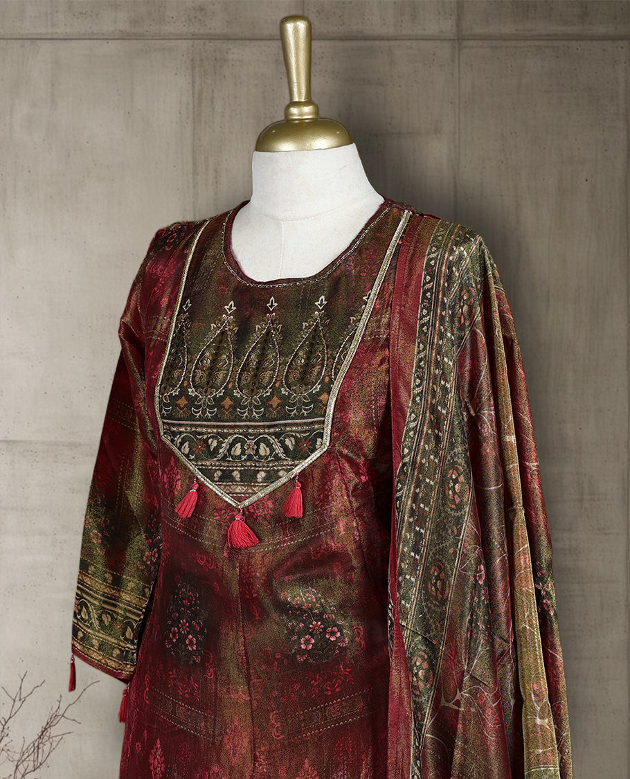Maroon and olive green salwar from TWARA, featuring a round neck with intricate zari embroidery and tassel detailing, paired with a matching bottom and a richly woven dupatta showcasing traditional motifs.