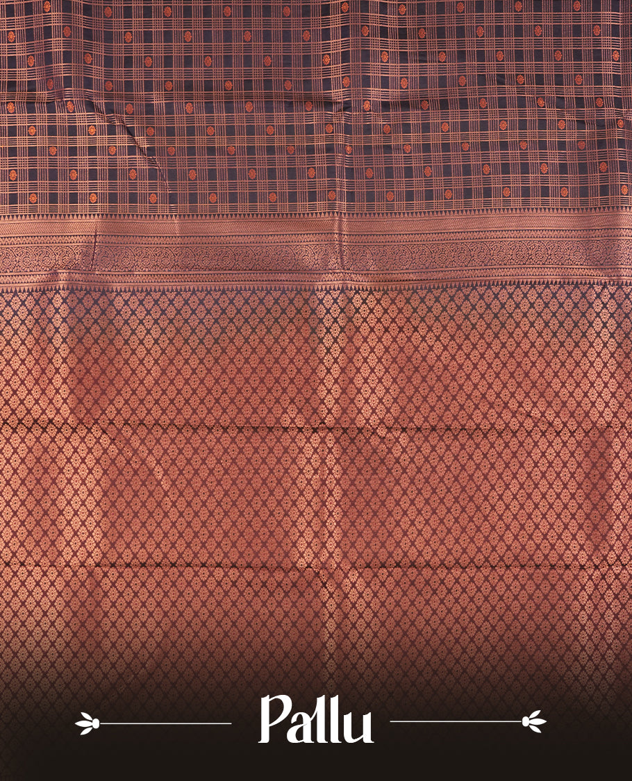 Dark blue colour Semi Silk Saree with copper zari checkered on the body, paired with a contrast chocolate brown colour pallu with copper zari traditioal border, and a matching blouse piece.