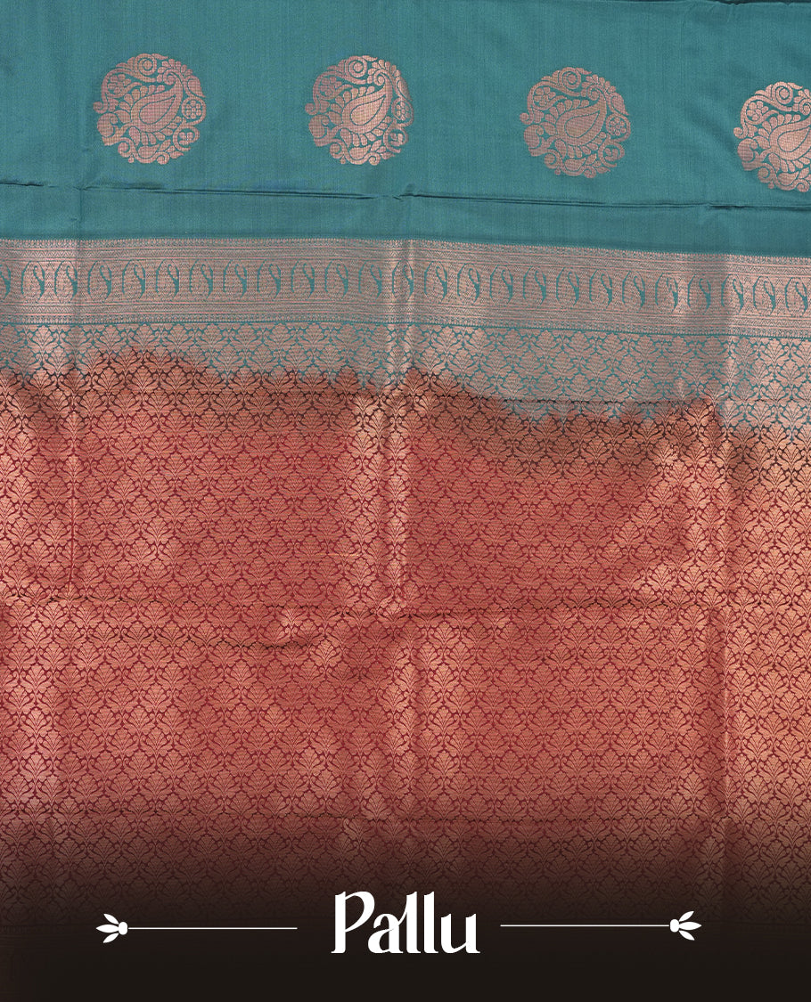 Teal colour Semi Silk Saree with gold zari motifs on the body, paired with a contrast Dark maroon colour pallu with gold zari traditioal border, and a matching blouse piece.