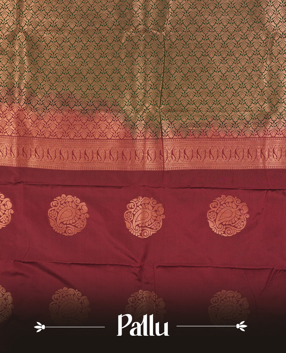 Dark green colour Semi Silk Saree with copper zari motifs on the body, paired with a contrast chocolate brown colour pallu with copper zari traditioal border, and a matching blouse piece.