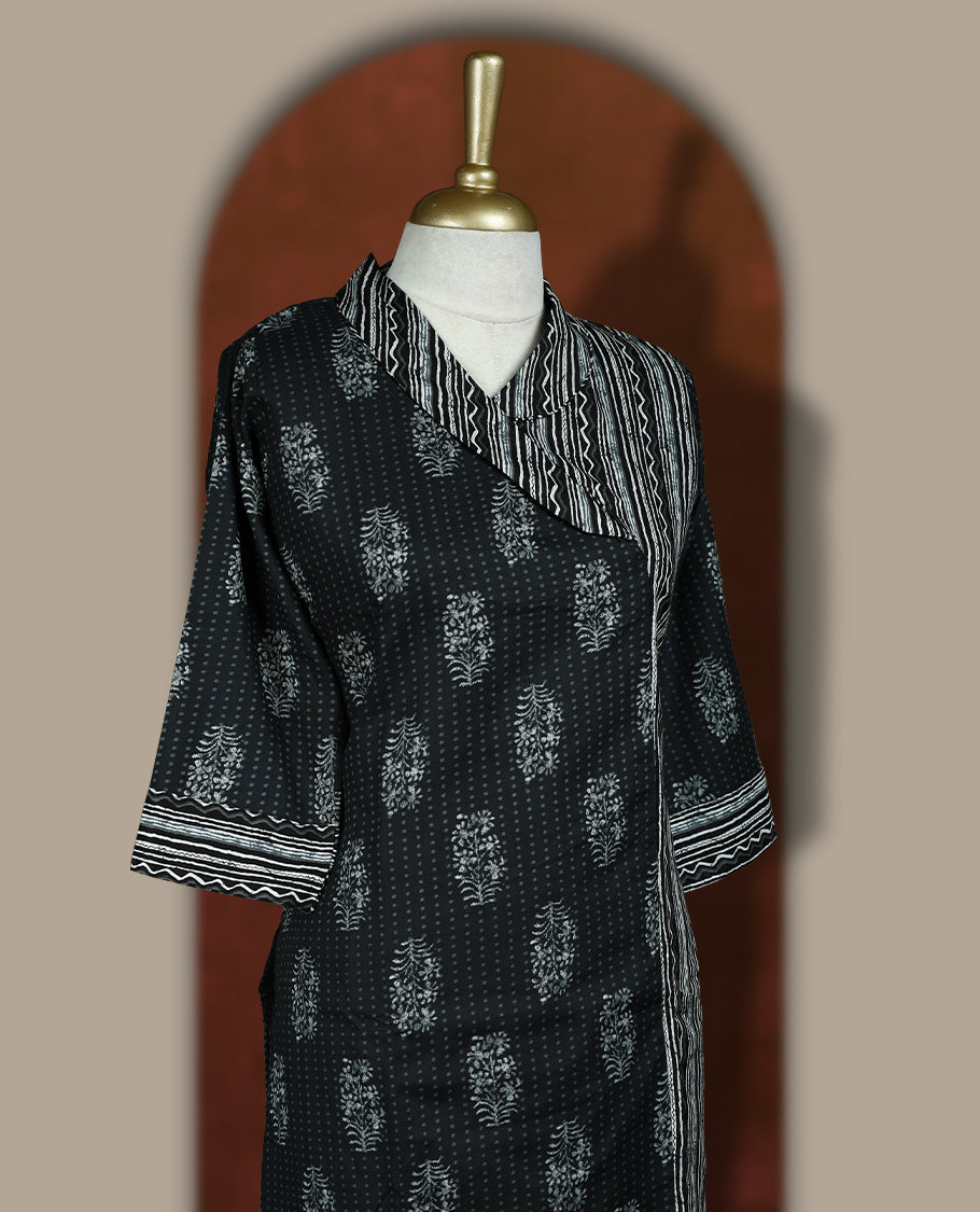 Black colour cotton coord set with floral and striped handblock prints, Features a stylish overlay design and elbow length sleeves & paired with matching striped wide leg pants.